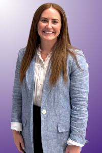 a young woman with reddish brown hair oes in front of a purple background
