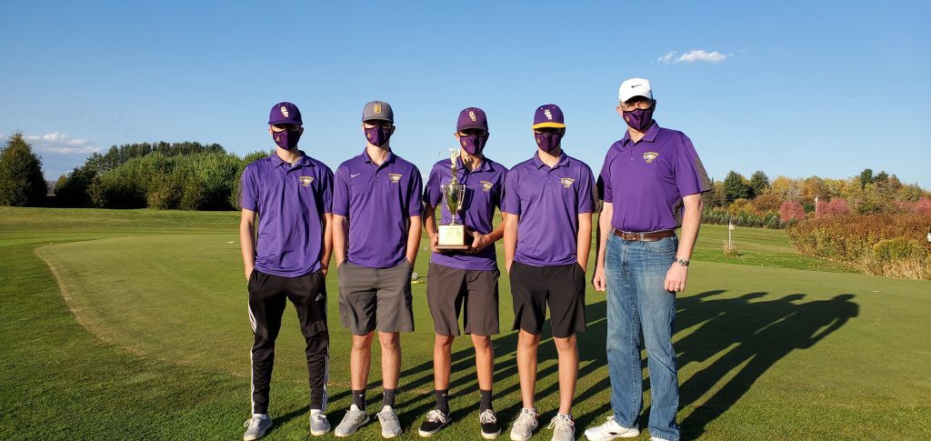 four high school golfers wearing baseball caps and purple polo shirts and masks with a golf coach
