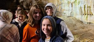 students explore a cave