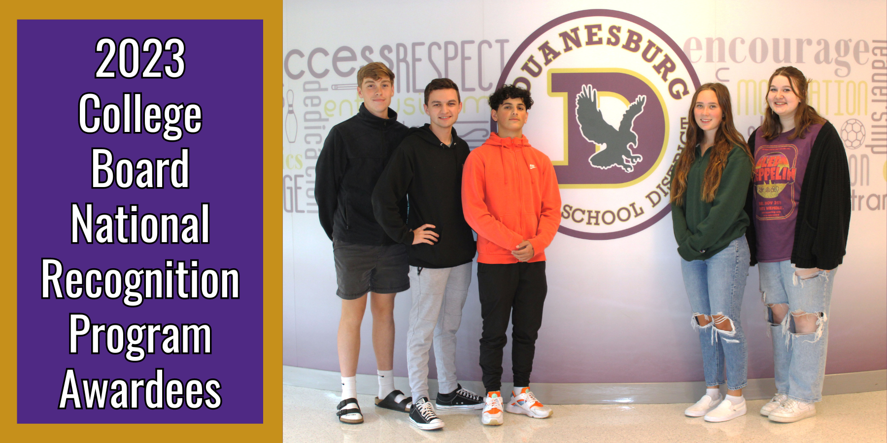 three male teenagers and two female teens stand in a hallway around their school logo