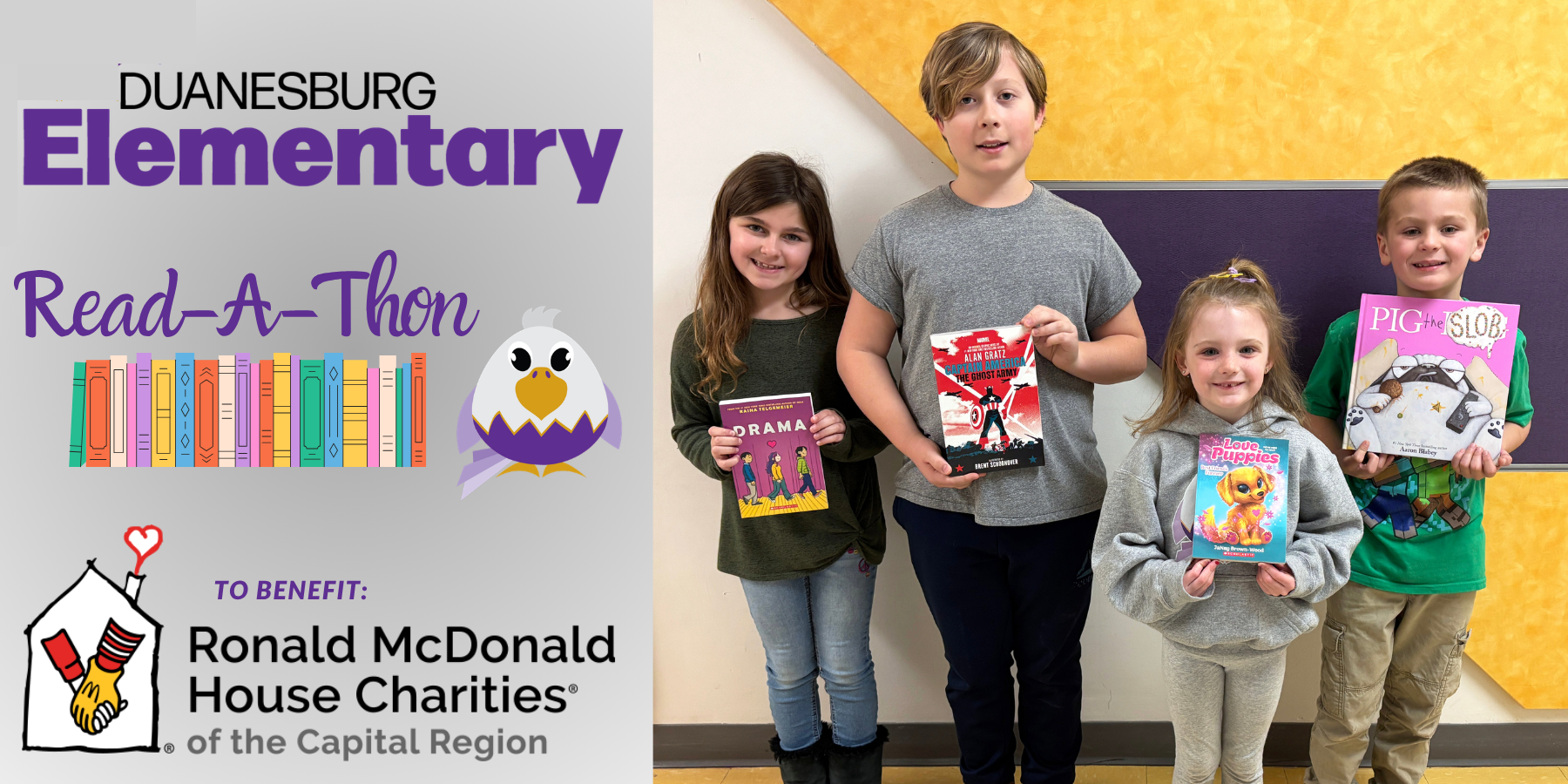 students pose with books in a hallway