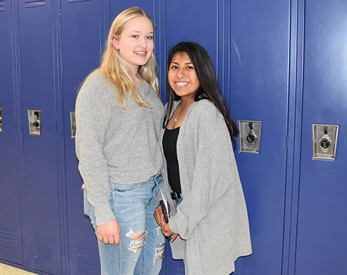 2 high school girls standing by lockers