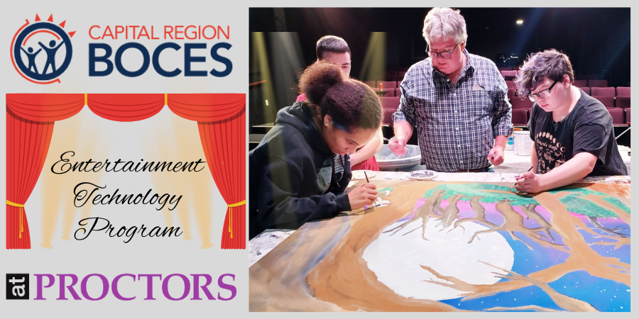 students paint scenery for a theatrical production
