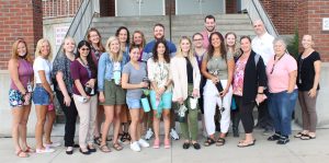 Duanesburg Central School District administrative staff and board of ed member with 14 new teachers at the annual new staff orientation in front of the high school entrance on Aug. 31l