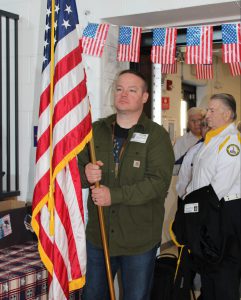 a man carries a flag