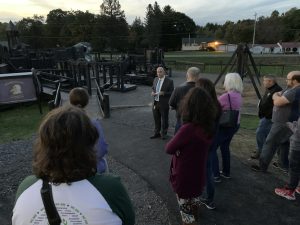 a group of people tours a playground