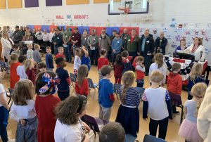 elementary students participate in an assembly
