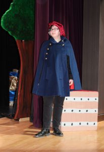 a student rehearses a scene on a theatrical stage