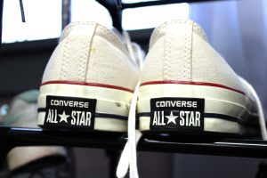 white sneakers show the name Convers All Star
