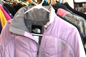 a purple winter coat shows the name North Face