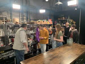 students explore a fake kitchen on the set of a television show