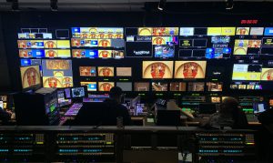 the inside of a control room on a television production set