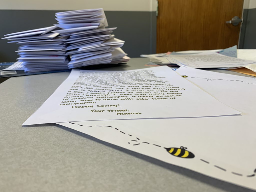 letters and envelopes on top of a desk