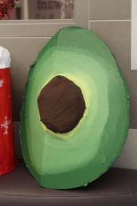a sculpture that looks like an avocado is on display