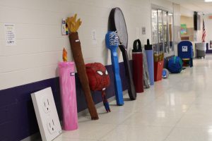 sculptures line the hallway at a school