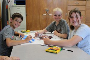 students color a poster