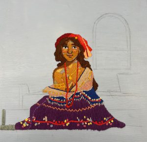 a needlepoint art project shows a woman wearing a skirt, yellow shirt and red bandana on her head
