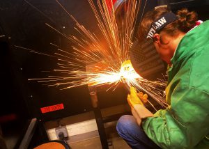 a young man is shown welding