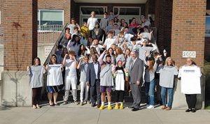 Senior Class poses with school and SUNY Schenectady officials on the high school steps at Instant Admit Day