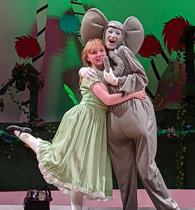 DCS high school actors in "Seussical" as girl, Horton hug on stage