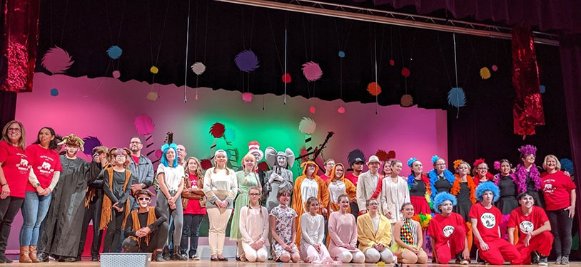 High school students on stage as cast and crew of "Seussical"