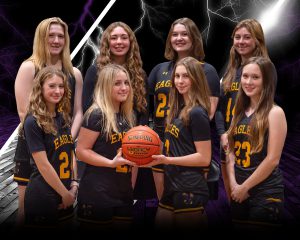 Eight teenaged women pose as a basketball team