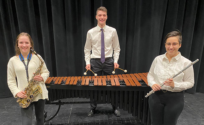3 students with instruments